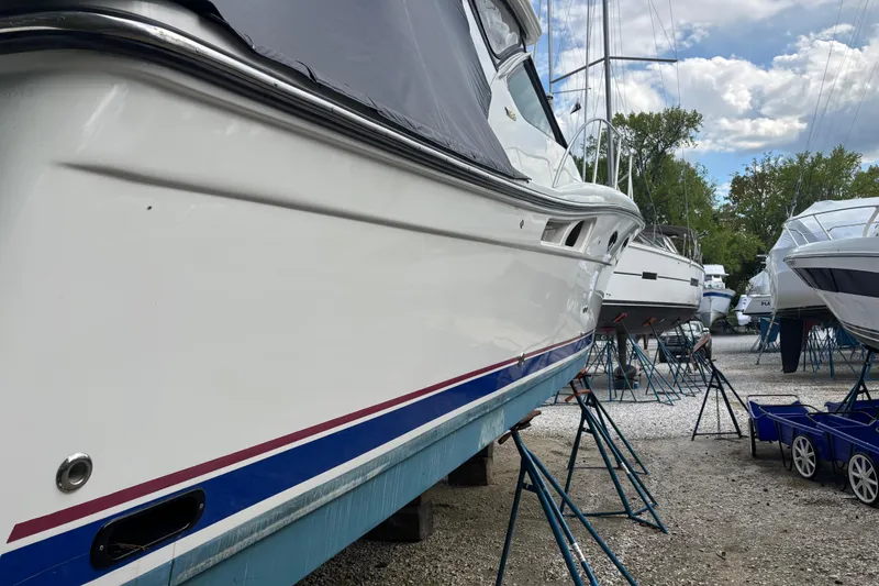 Slide: The Image of 2005 Tiara Yachts 3600 Open on stands, side view, in a boatyard. - 38