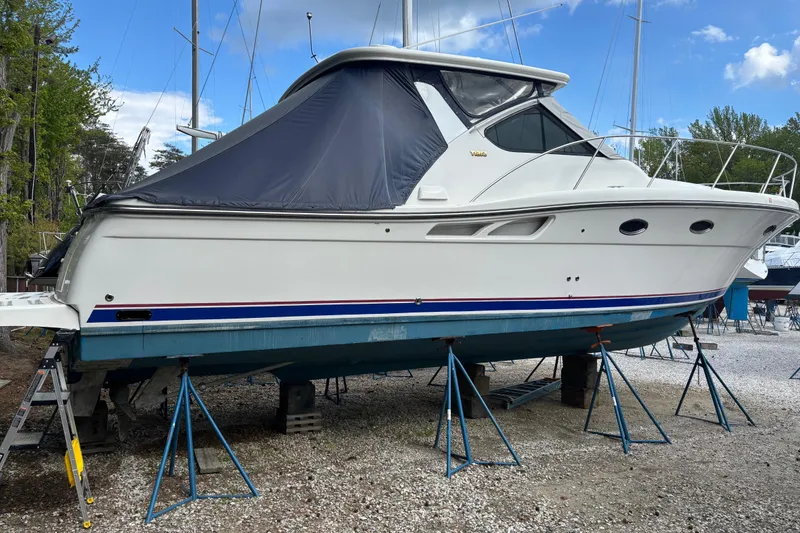 Slide: The Image of 2005 Tiara Yachts 3600 Open on stands, white hull, blue cover, outdoor setting. - 39