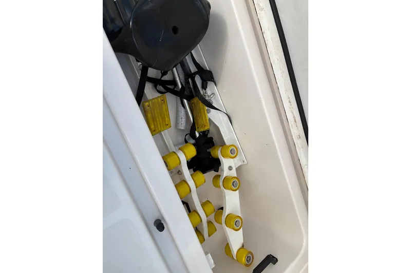 Slide: The Image of 2005 Tiara Yachts 3600 Open boat compartment with yellow rollers and equipment. - 40