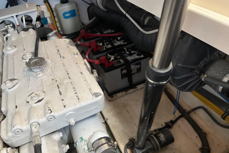 Slide: The Image of Engine compartment of a 2005 Tiara Yachts 3600 Open, showing batteries and mechanical components. - 43
