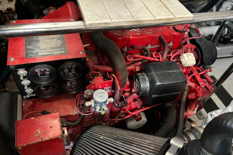 Slide: The Image of Engine compartment of a 2005 Tiara Yachts 3600 Open, featuring a red Westerbeke generator. - 45