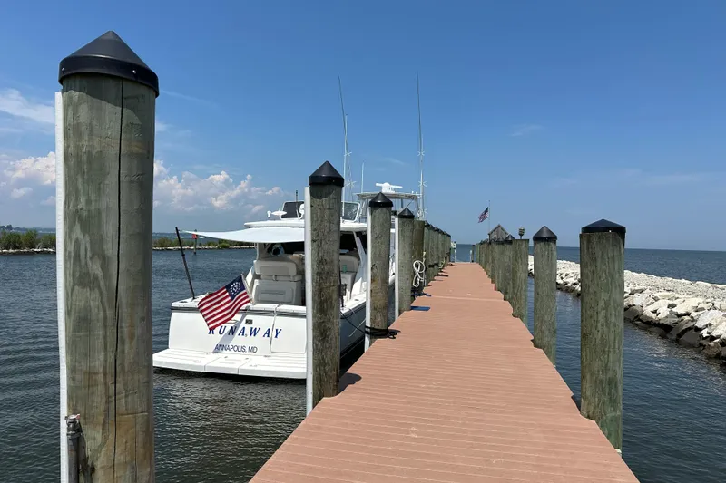 Slide: The Image of Docked 2005 Tiara Yachts 3600 Open with American flag, Annapolis marina. - 6
