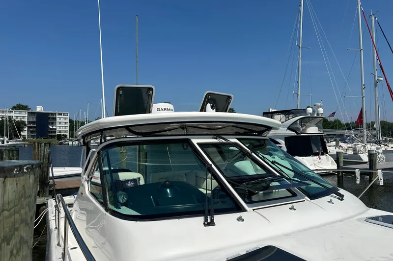 Slide: The Image of 2005 Tiara Yachts 3600 Open docked at marina with clear blue sky. - 8