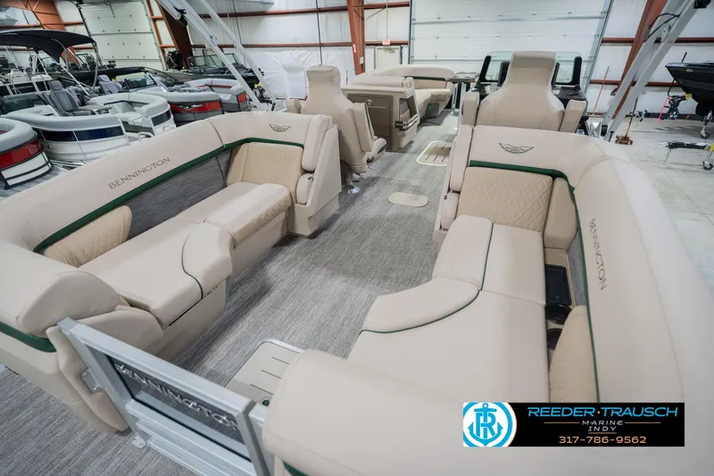Slide: The Image of Luxurious interior of 2026 Bennington 24 MFB pontoon boat in showroom. - 13