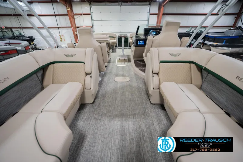 Slide: The Image of Luxurious interior of 2026 Bennington 24 MFB pontoon boat in showroom setting. - 18