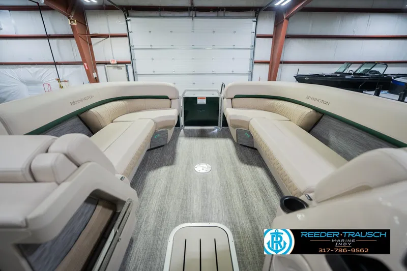 Slide: The Image of Interior of 2026 Bennington 24 MFB pontoon boat with luxurious seating in a showroom. - 21