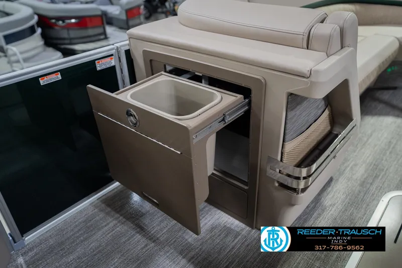 Slide: The Image of 2026 Bennington 24 MFB boat interior with pull-out storage compartment. - 26