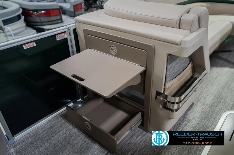 Slide: The Image of 2026 Bennington 24 MFB boat interior with storage compartments and seating. - 27