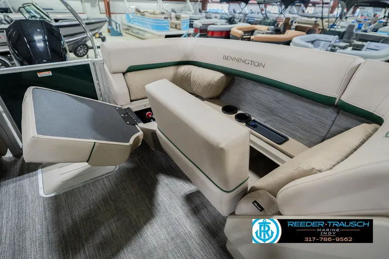 Slide: The Image of 2026 Bennington 24 MFB boat interior with beige seating and cup holders. - 31