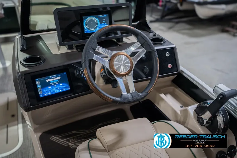 Slide: The Image of Interior of 2026 Bennington 24 MFB boat with modern steering and digital displays. - 33