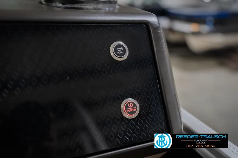 Slide: The Image of Control panel of 2026 Bennington 24 MFB boat with horn and power buttons. - 37