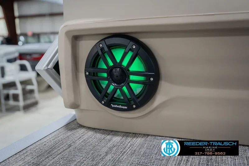 Slide: The Image of 2026 Bennington 24 MFB boat with illuminated Rockford Fosgate speaker, showcased at Reeder Trausch Marine. - 46