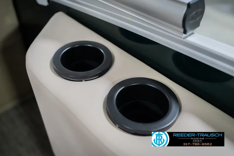 Slide: The Image of Cup holders on 2026 Bennington 24 MFB boat, Reeder Trausch Marine logo visible. - 49