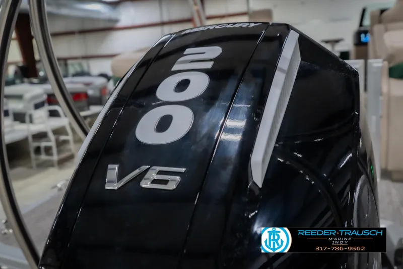 Slide: The Image of 2026 Bennington 24 MFB with Mercury 200 V6 engine in showroom. - 53