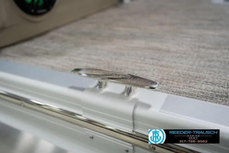 Slide: The Image of Bennington 24 MFB 2026 boat cleat detail with Reeder Trausch Marine logo. - 62