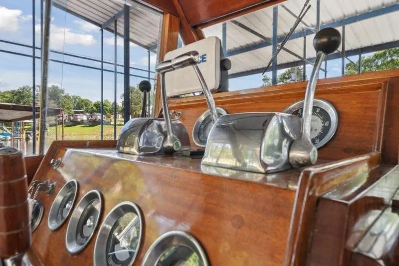 Slide: The Image of 1964 Chris-Craft 37 Constellation helm with vintage controls and gauges. - 12