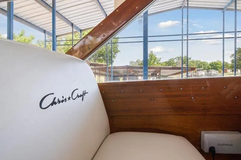 Slide: The Image of Interior of 1964 Chris-Craft 37 Constellation boat with white seating and wooden accents. - 13