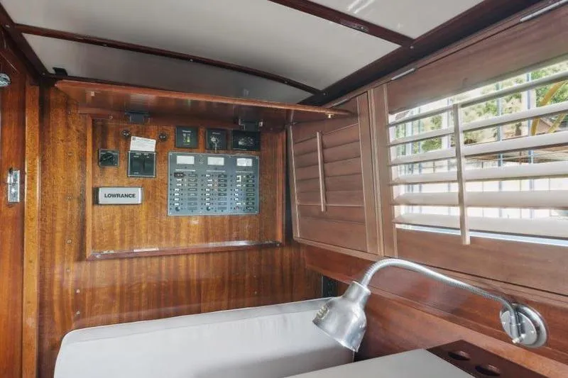 Slide: The Image of 1964 Chris-Craft 37 Constellation interior with wooden paneling and control panel. - 17