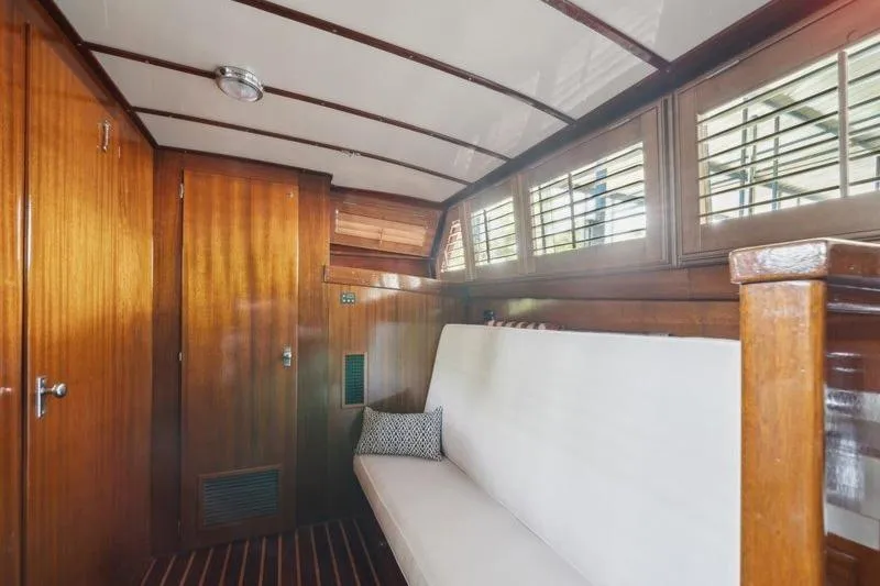 Slide: The Image of Interior of 1964 Chris-Craft 37 Constellation with wooden paneling and white seating. - 23
