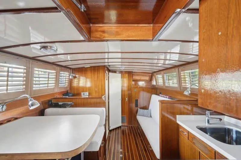 Slide: The Image of 1964 Chris-Craft 37 Constellation interior with wood paneling and modern amenities. - 25