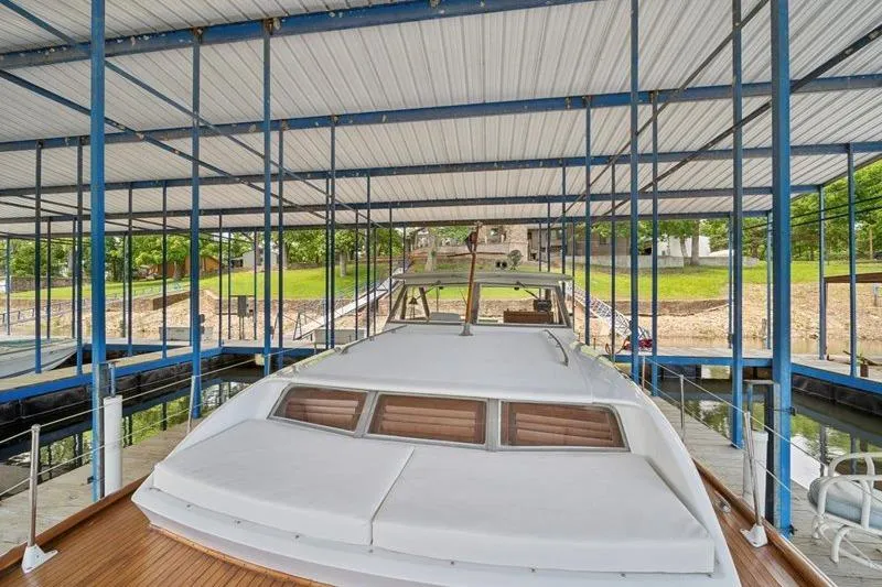 Slide: The Image of 1964 Chris-Craft 37 Constellation docked under covered marina. - 32