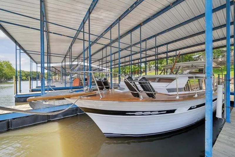 Slide: The Image of 1964 Chris-Craft 37 Constellation docked under covered marina. - 5