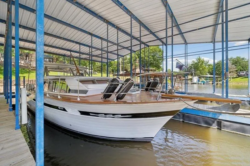 Slide: The Image of 1964 Chris-Craft 37 Constellation docked under covered marina. - 9