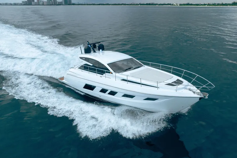 Slide: The Image of 2019 Filippetti S55 yacht cruising on open water, showcasing sleek design and performance. - 3