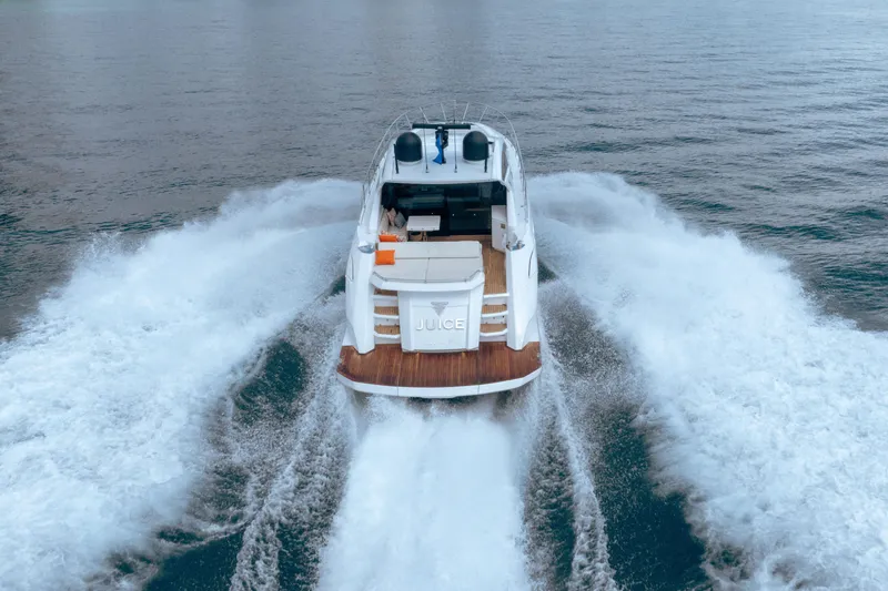 Slide: The Image of 2019 Filippetti S55 yacht cruising on open water, rear view. - 4