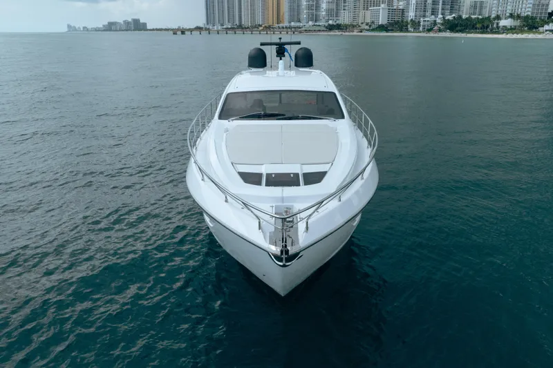 Slide: The Image of 2019 Filippetti S55 yacht on calm water with city skyline in background. - 7
