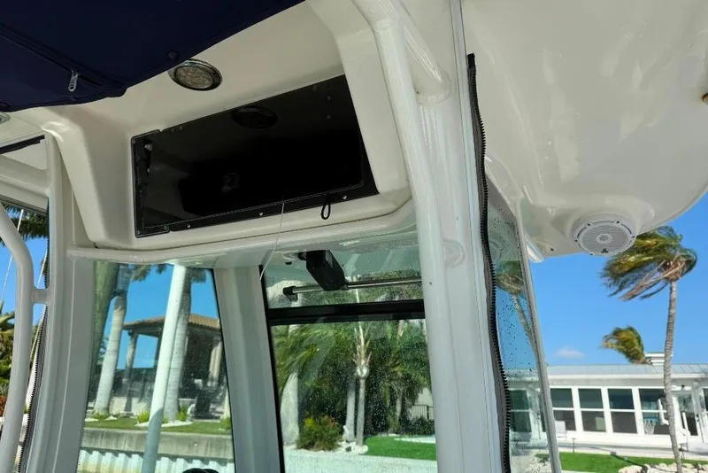 Slide: The Image of 2012 Boston Whaler 250 Outrage interior with speaker and window view. - 10