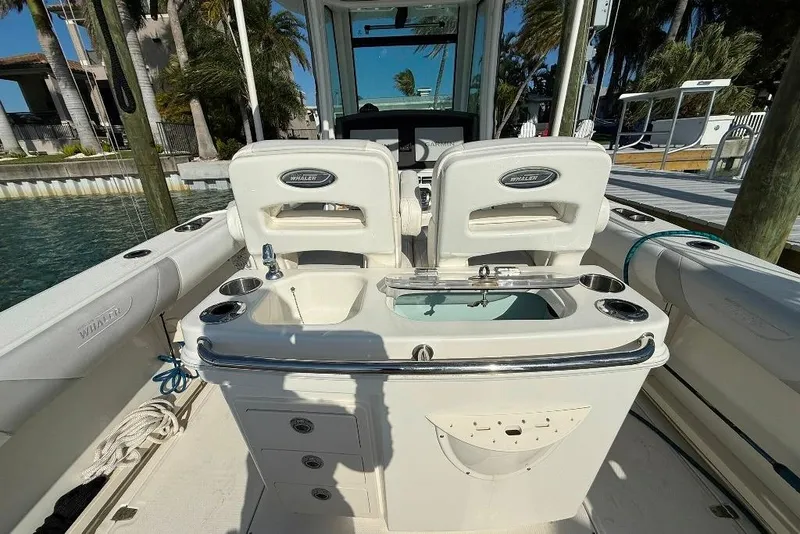 Slide: The Image of 2012 Boston Whaler 250 Outrage boat interior with seating and fishing station. - 17