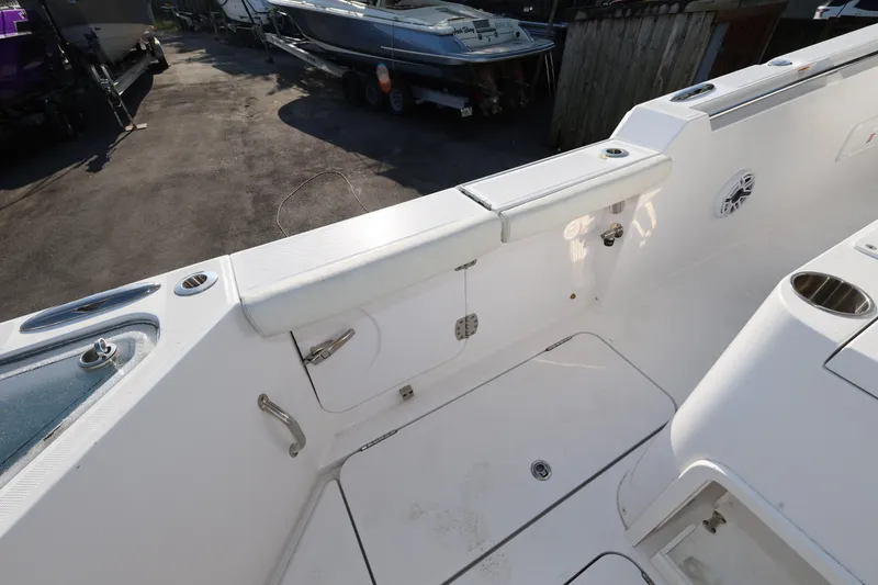 Slide: The Image of 2023 Bertram 28 CC boat deck with seating and storage compartments. - 25