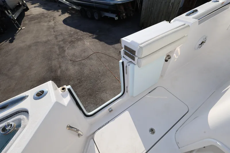 Slide: The Image of 2023 Bertram 28 CC boat deck with open transom door and seating. - 26