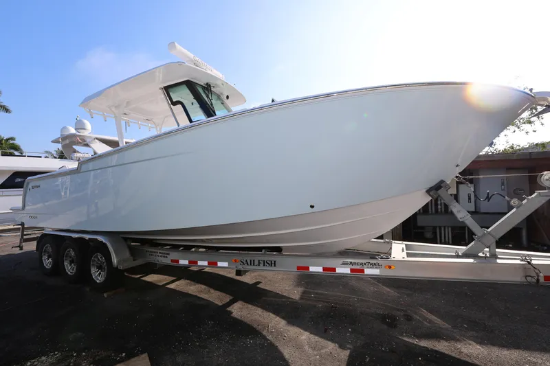 Slide: The Image of 2023 Bertram 28 CC boat on trailer, side view, sunny day. - 7