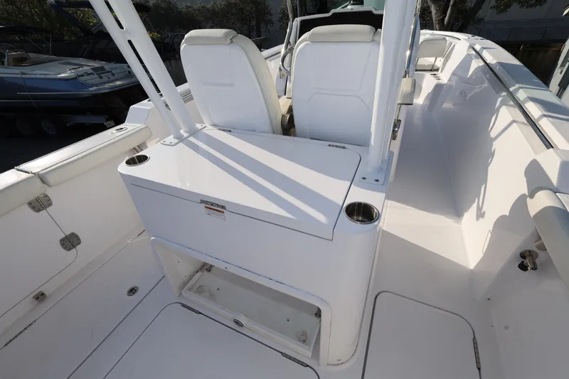 Slide: The Image of 2023 Bertram 28 CC boat interior with seating and storage compartments. - 8