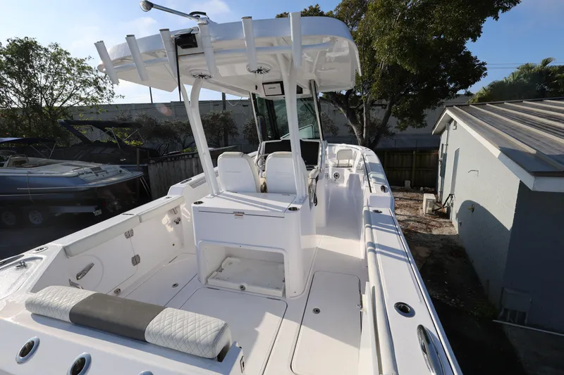 Slide: The Image of 2023 Bertram 28 CC boat with sleek white interior and spacious deck. - 9