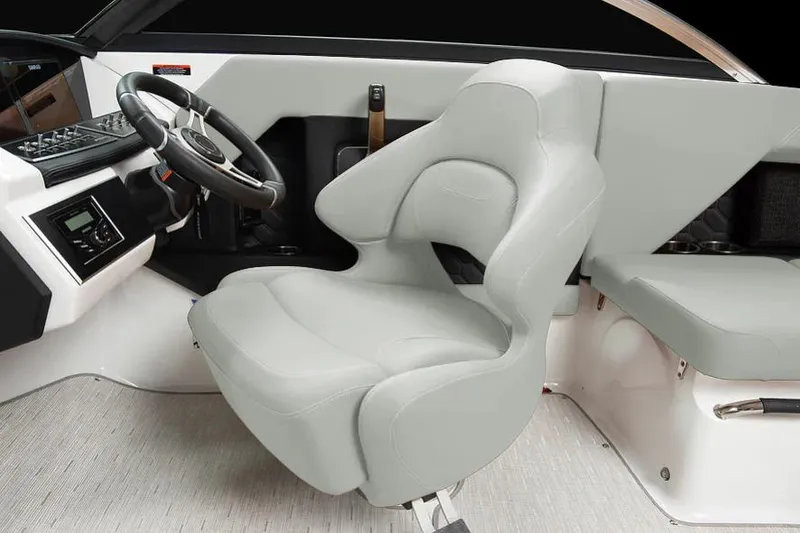 Slide: The Image of 2026 Four Winns H2 boat interior with modern steering and plush seating. - 2