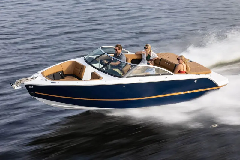 Slide: The Image of Manufacturer Provided Image: 2025 Four Winns H2 boat cruising on water with passengers enjoying the ride. - 4