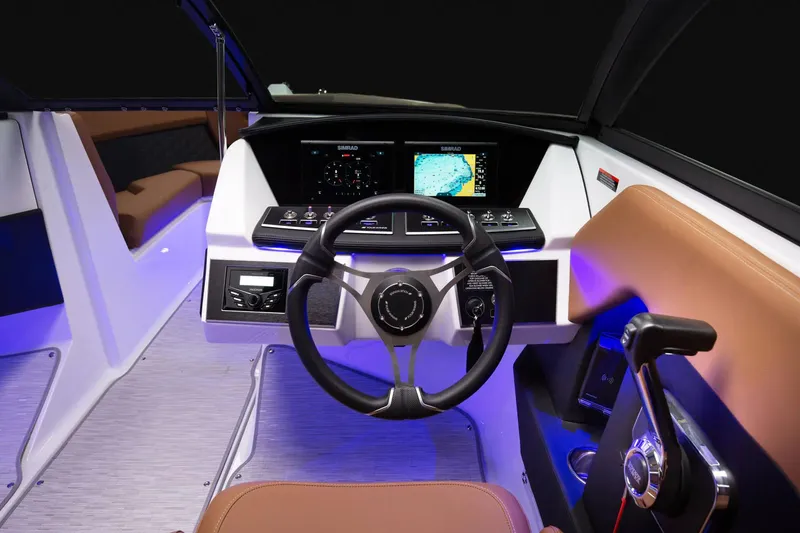 Slide: The Image of Manufacturer Provided Image: 2025 Four Winns H2 boat cockpit with modern steering and navigation system. - 9