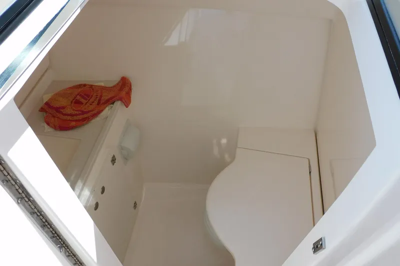 Slide: The Image of 2016 Pursuit DC 325 Dual Console boat interior with seating and storage. - 11