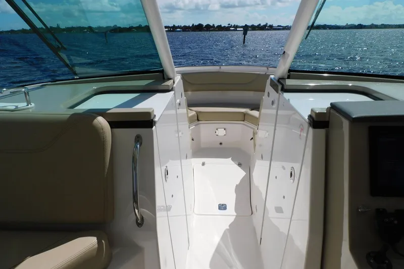 Slide: The Image of 2016 Pursuit DC 325 Dual Console boat interior with ocean view. - 12