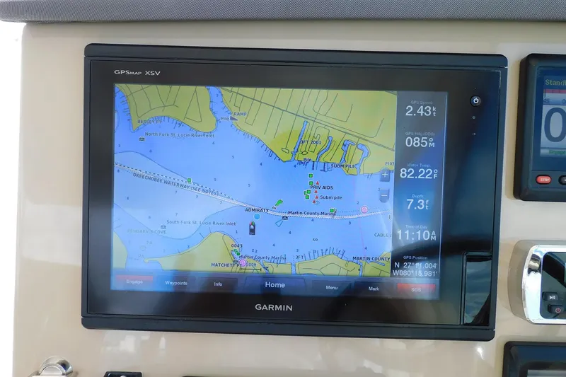 Slide: The Image of Garmin GPS display on 2016 Pursuit DC 325 Dual Console boat, showing navigation map and data. - 17