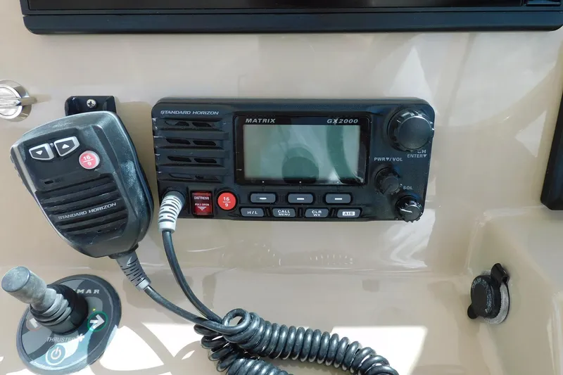 Slide: The Image of Control panel of a 2016 Pursuit DC 325 Dual Console with Standard Horizon GX2000 radio. - 20