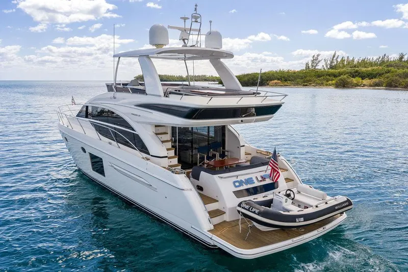 Slide: The Image of 2016 Princess 60 Flybridge Motor Yacht cruising on serene waters. - 10