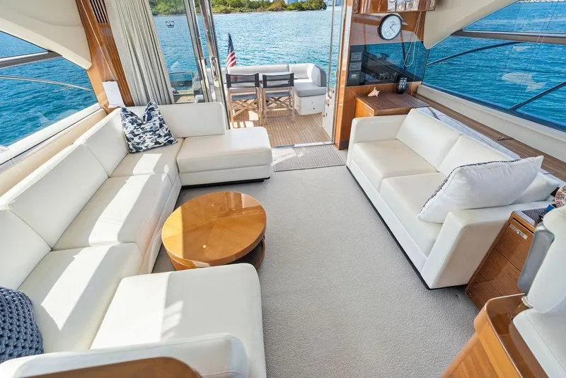 Slide: The Image of Luxurious interior of 2016 Princess 60 Flybridge Motor Yacht with white sofas and ocean view. - 26