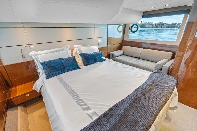 Slide: The Image of Luxurious bedroom in 2016 Princess 60 Flybridge Motor Yacht with scenic window view. - 41
