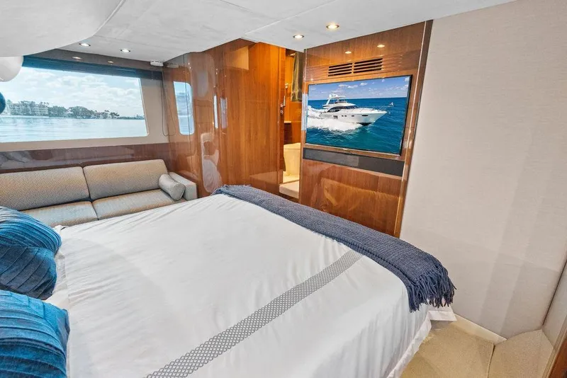 Slide: The Image of Luxurious bedroom interior of 2016 Princess 60 Flybridge Motor Yacht with scenic window view. - 43