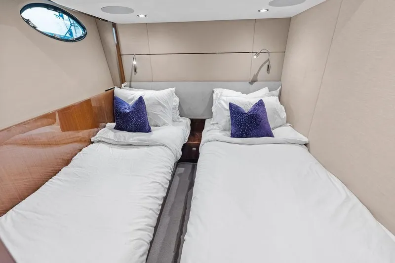 Slide: The Image of Twin beds in a 2016 Princess 60 Flybridge Motor Yacht cabin with plush pillows. - 48