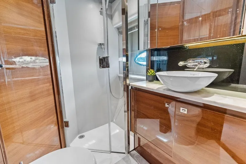 Slide: The Image of Luxurious bathroom in 2016 Princess 60 Flybridge Motor Yacht with modern fixtures and wood accents. - 51
